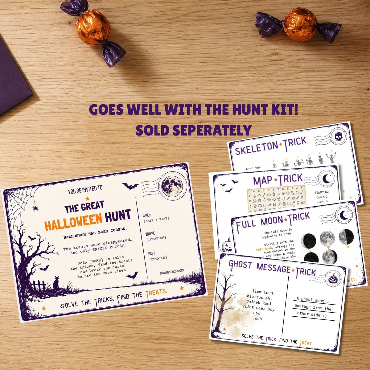 Halloween hunt game cards displayed on a wooden tabletop with candy and a pumpkin nearby. The set includes a main invitation card and several clue cards such as skeleton trick, map trick, full moon trick, and ghost message trick.