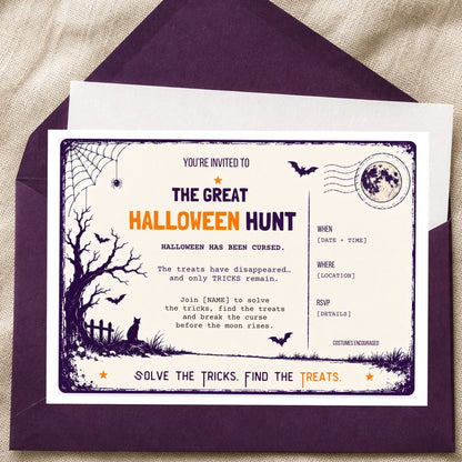 A Halloween-themed invitation card with a matching dark purple envelope, laid on a beige fabric background. The card reads 'The Great Halloween Hunt' and includes spooky illustrations such as a tree, bats, a cat, a fence, and a moon stamp.