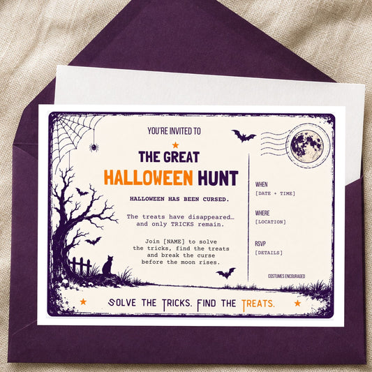 A Halloween-themed invitation card with a matching dark purple envelope, laid on a beige fabric background. The card reads 'The Great Halloween Hunt' and includes spooky illustrations such as a tree, bats, a cat, a fence, and a moon stamp.